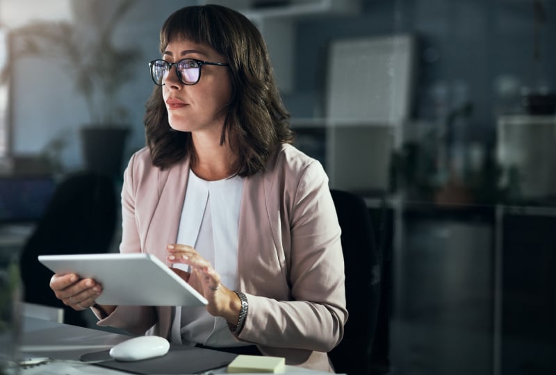 woman entering data into a tablet device