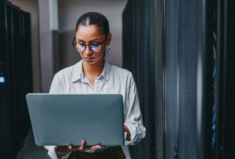 woman typing into laptop computer