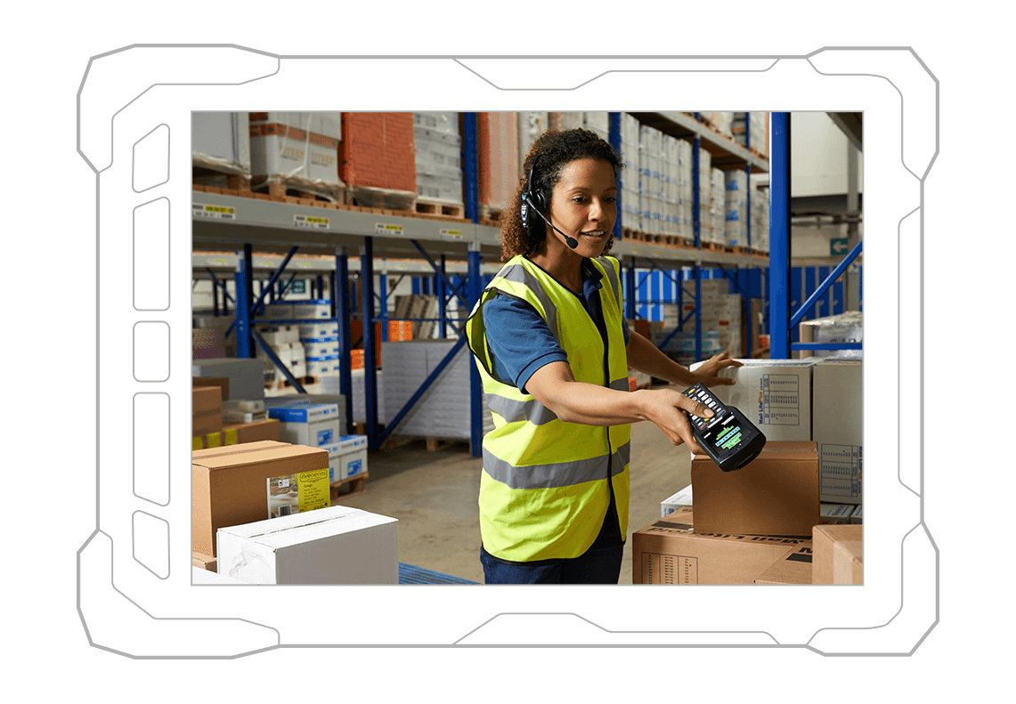 worker in warehouse scanning boxes