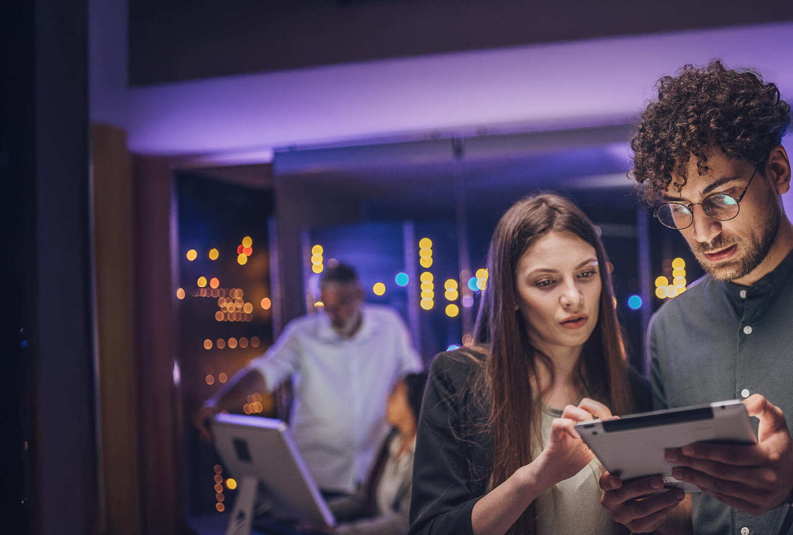 two people looking at an ipad