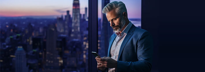 man reading message on mobile phone